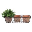 3 terracotta pots in wire basket